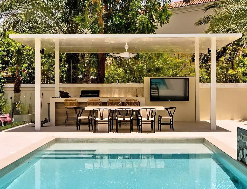 65-inch Apollo enclosure beneath a Jumeirah Village Triangle villa pergola beside a pool